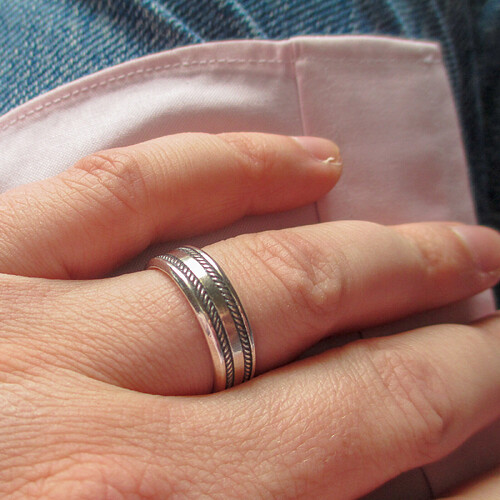 Close-up photo of my own wedding band on my ring finger