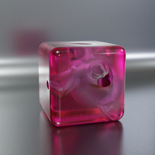 suzanne shaped bubble in a fuschia coloured plastic cube