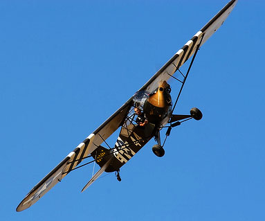http://www.fiddlersgreen.net/aircraft/Piper-L4-Grasshopper/IMAGES/Piper-L-4-Grasshopper-WWII-Military-Light-Aircraft-Banking.jpg