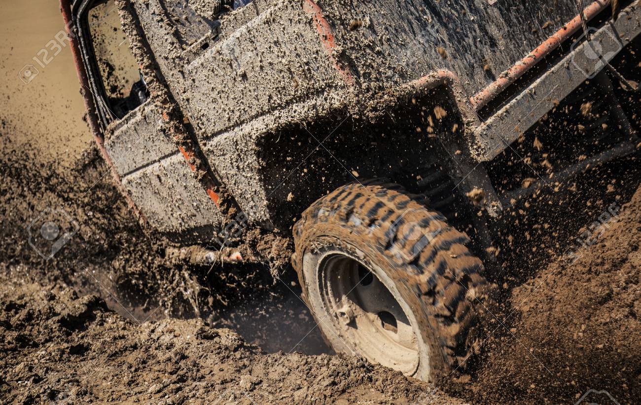 105450291-wheels-of-off-road-car-stuck-full-of-mud