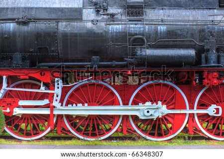 http://thumb1.shutterstock.com/display_pic_with_logo/173680/173680,1291249587,4/stock-photo-old-steam-locomotive-with-big-red-and-white-wheels-side-view-66348307.jpg
